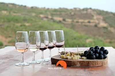 a group of wine glasses and a tray of cheese and grapes at #064 Families Only - Oh Live by Home Holidays in Albufeira