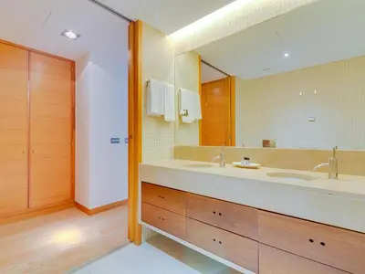 a living room with a couch and a table at Vale do lobo, 'Golf by the Pool' 2 bedroom apartment in Vale do Lobo