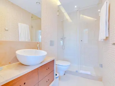 two beds sitting next to each other in a bedroom at Vale do lobo, 'Golf by the Pool' 2 bedroom apartment in Vale do Lobo