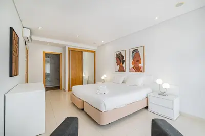 a room with two ping pong tables and couches at Marina Sol by Atlantic Places in Albufeira