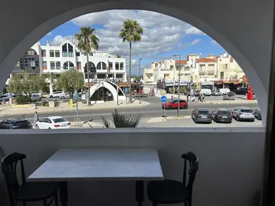 a view of a park from a window with a table at Sta. Eulalia Mar A29 in Albufeira