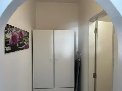 a room with a white cabinet and a mirror at Sta. Eulalia Mar A29 in Albufeira