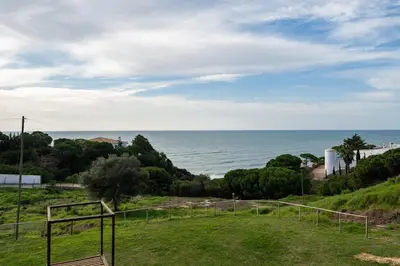 a view of the ocean from a house at Pedra dos Bicos by Intiholidays in Albufeira