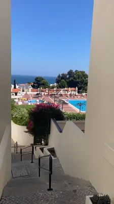 a view of a swimming pool from a building at Albufeira Garden in Albufeira
