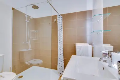a bathroom with a sink and a toilet at AL - Ocean Wide View in Quarteira