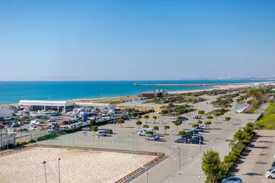an aerial view of a parking lot near the beach at AL - Ocean Wide View in Quarteira