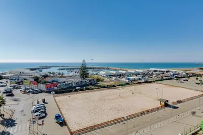 an aerial view of a parking lot at the beach at AL - Ocean Wide View in Quarteira