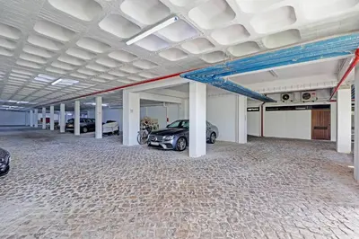 a parking garage with a car parked in it at Home Out Vilamoura 20 Levante in Vilamoura