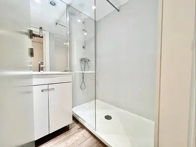 a white bathroom with a shower and a sink at Home Out Vilamoura 20 Levante in Vilamoura