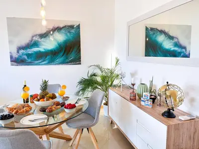 a dining room with a table with food on it at AlbufeiraOrada Gem by Be Cherish in Albufeira