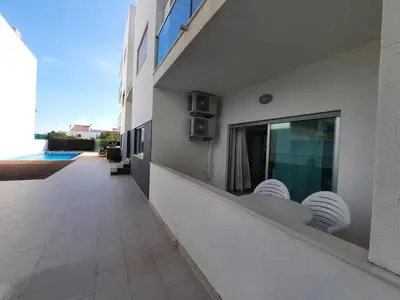 a balcony of a building with a view of a pool at Casa Mandala, T1 com piscina in Albufeira