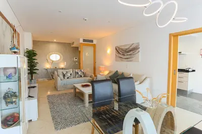 a living room with a couch and a table at Marina Vilamoura - Aquamar 217 - By Vilamoura Sun in Quarteira