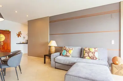a living room with a couch and a table at VilamouraSun Aquamar 406 - Vista Marina in Quarteira