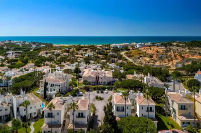 an aerial view of a house with the ocean at Casa Ch'i - Vale de Lobo in Almancil