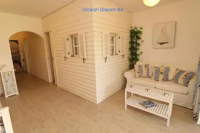 a living room with a couch and a table at Ocean Dream 84 - Apt. T1 na Praia de São Rafael, Albufeira in Albufeira