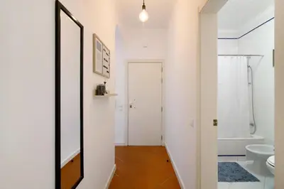 a white bathroom with a toilet and a sink at Apartamento Medusa by Sunnyway in Olhos de Água