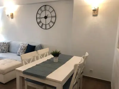 a living room with a couch and a table at Apartamento Oceano in Albufeira