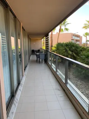 a balcony of a building with a table and chairs at Salgados - Vila das Lagoas in Guia