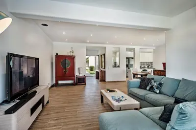 a living room with a couch and a flat screen tv at Silva by Algarve Villa Holidays in Albufeira