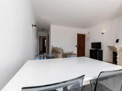 a white table and chairs in a living room at Akisol Albufeira Water in Albufeira