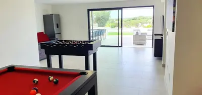 a kitchen with a red pool table and a stove at Sky Villa by Laranjal Rentals in Albufeira