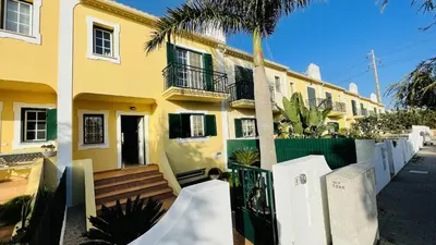 a yellow house with a ramp in front of it at Mosqueira by Check-in Portugal in Albufeira