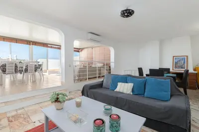 a living room with a couch and a table at Apartment Marina in Albufeira