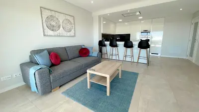 a living room with a couch and a table at Alvorada Premium by Sunny Deluxe in Albufeira