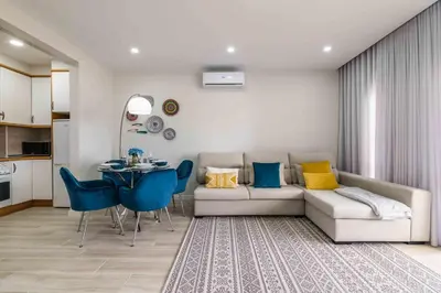 a living room with a couch and a table at Casa Santa Maria - Sea View - 500m from the Beach - WiFi in Albufeira