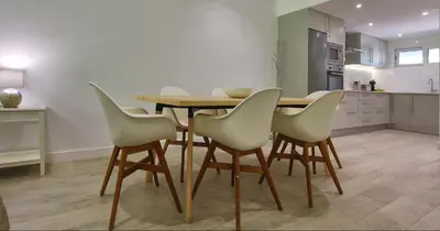 a kitchen with a wooden table and four chairs at Victory Village 20B in Quinta do Lago