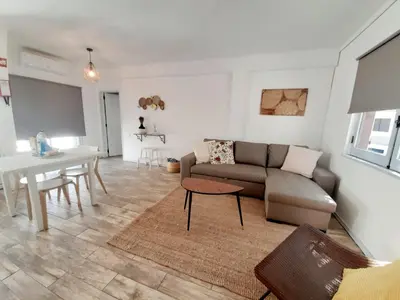 a living room with a couch and a table at Apartamento Patrick by Sunnyway in Albufeira