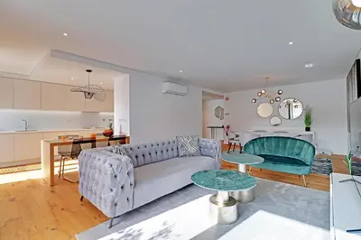 a living room with a couch and a table at Dubai Apartment in Vilamoura