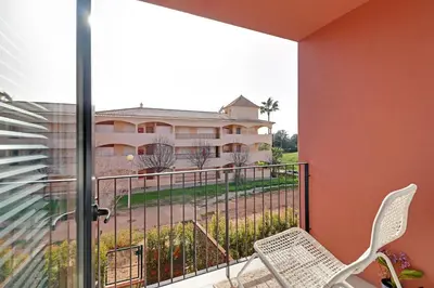 a balcony with a view of a building at Dubai Apartment in Vilamoura