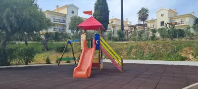 a playground with a slide in a park at Sweet Garden by SpotOn Apartments in Albufeira