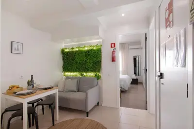 a living room with a couch and a table at Casa Maria in Faro
