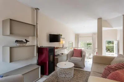 a living room with a couch and a table at Townhouse Seraphina in Vale do Lobo