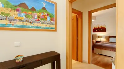 a hotel room with a painting of a beach at Villa Terraços da Vinha 230 - Clever Details in Vilamoura