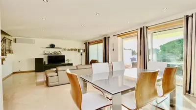 a dining room with a table and chairs at Villa Terraços da Vinha 230 - Clever Details in Vilamoura