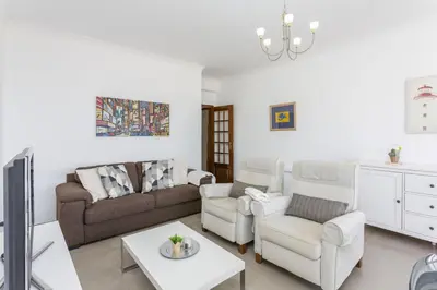 a living room with a couch and chairs and a table at Miral 3 - Sea front by HD PROPERTIES in Quarteira