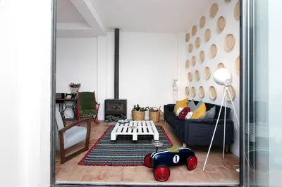 a living room with a couch and a table at Casa Loulé in Loulé