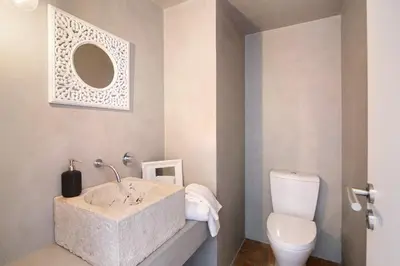 a bathroom with a sink and a toilet at Casa Loulé in Loulé
