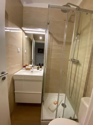 a bathroom with a shower and a sink at Cosy Avenida Apartment in Faro