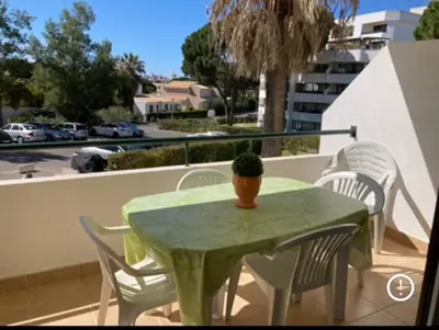 a bathroom with a mirror and a table with a plant at Vilamoura holidays house in Vilamoura