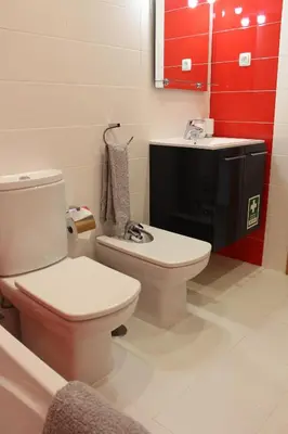 a bathroom with a toilet and a sink at Casa Jaffa in Albufeira