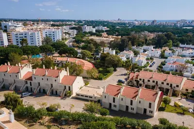 an aerial view of a residential neighbourhood with buildings at Gorgeous 2BDR Apartment W/Patio & Pool by LovelyStay in Vilamoura