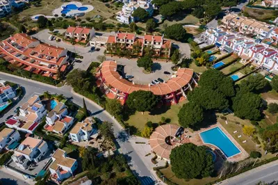 an aerial view of a residential estate with a pool at Gorgeous 2BDR Apartment W/Patio & Pool by LovelyStay in Vilamoura