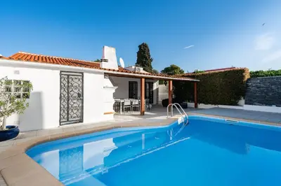 a villa with a swimming pool and a house at Villa Vitry by Intiholidays in Albufeira