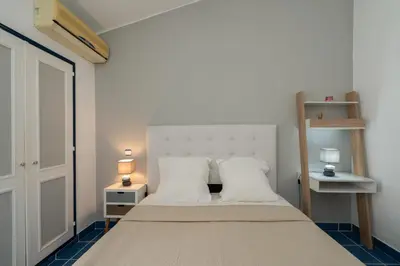 a bedroom with a bed with two white pillows at Villa Vitry by Intiholidays in Albufeira