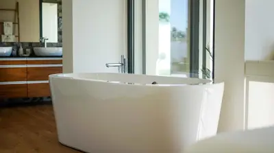 a white tub in a bathroom with a sink at Villa Videira By Dalma Portuguesa - By Dalma Portuguesa in Albufeira