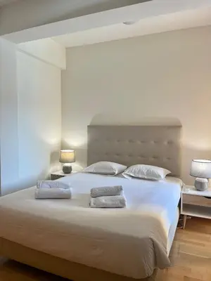 a bedroom with a large bed with two pillows at Wonderful Apartment Albufeira Marina 4B 2B in Albufeira